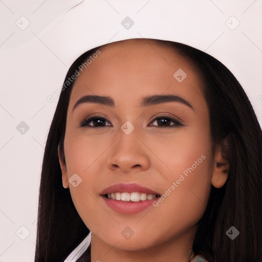 Joyful white young-adult female with long  black hair and brown eyes