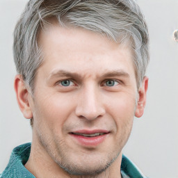 Joyful white adult male with short  brown hair and grey eyes