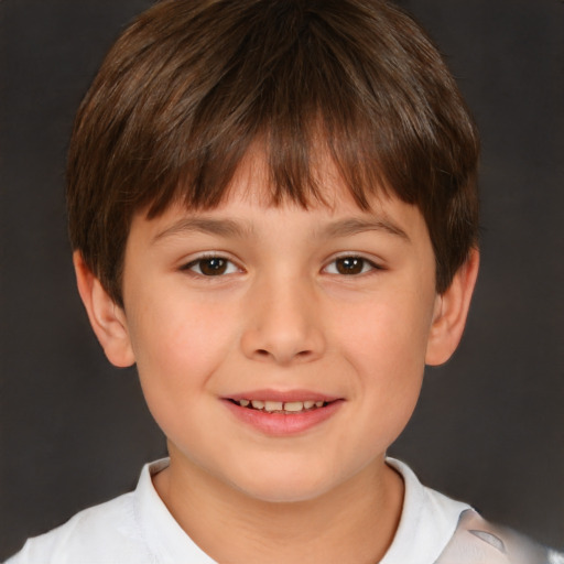 Joyful white child male with short  brown hair and brown eyes