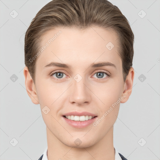 Joyful white young-adult female with short  brown hair and grey eyes