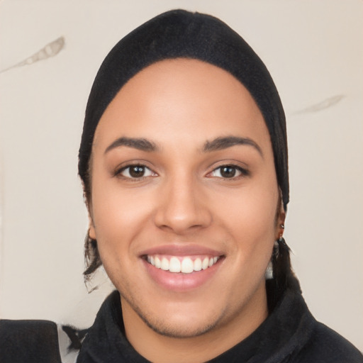 Joyful white young-adult female with long  black hair and brown eyes