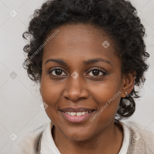 Joyful black young-adult female with long  brown hair and brown eyes