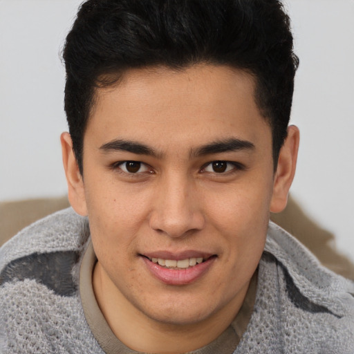 Joyful latino young-adult male with short  brown hair and brown eyes
