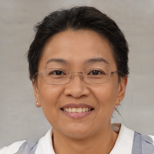 Joyful white adult female with short  brown hair and brown eyes