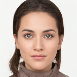 Neutral white young-adult female with long  brown hair and brown eyes