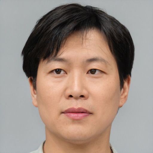 Neutral asian adult male with short  brown hair and brown eyes