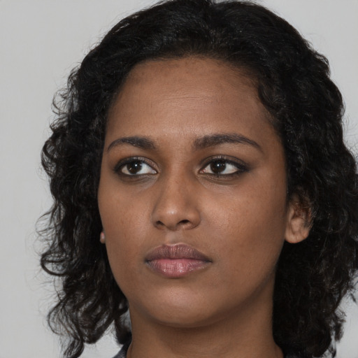 Neutral black young-adult female with long  black hair and brown eyes