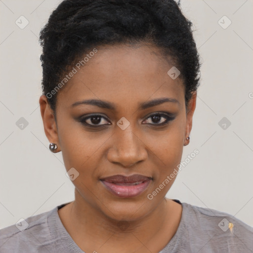 Joyful black young-adult female with short  black hair and brown eyes