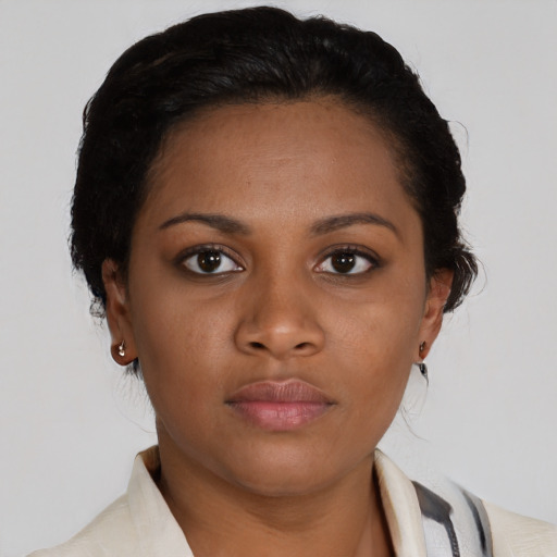 Neutral black young-adult female with medium  brown hair and brown eyes