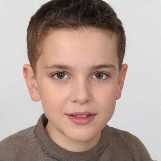 Joyful white child male with short  brown hair and brown eyes