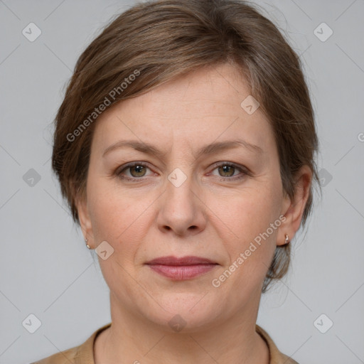 Joyful white adult female with medium  brown hair and grey eyes