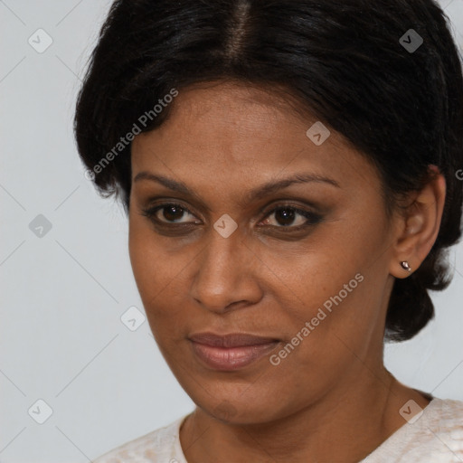 Joyful black adult female with short  brown hair and brown eyes