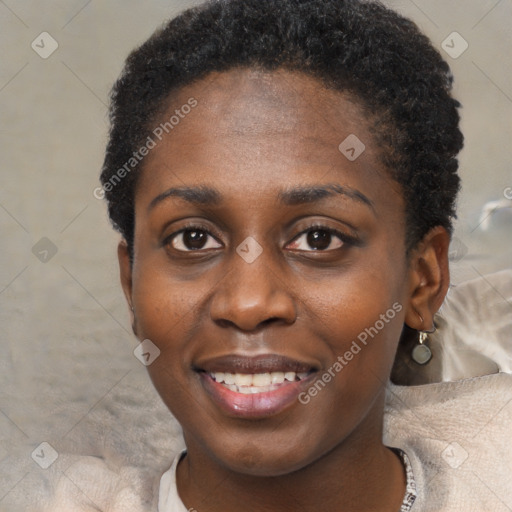 Joyful black young-adult female with short  black hair and brown eyes