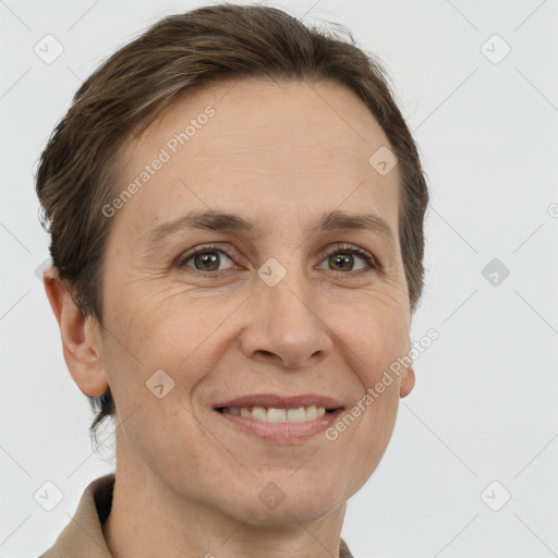 Joyful white adult female with short  brown hair and brown eyes