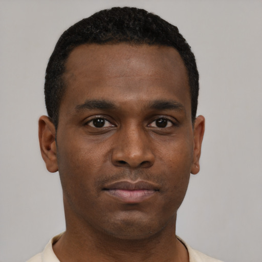 Neutral black young-adult male with short  black hair and brown eyes
