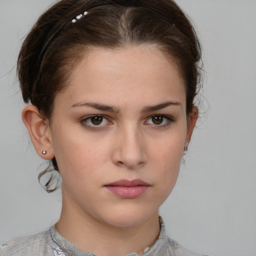 Neutral white young-adult female with medium  brown hair and grey eyes