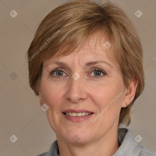 Joyful white adult female with medium  brown hair and grey eyes