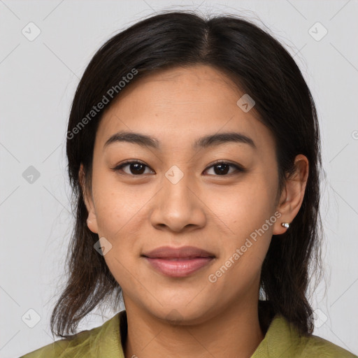 Joyful asian young-adult female with medium  brown hair and brown eyes