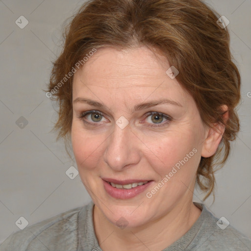 Joyful white adult female with medium  brown hair and blue eyes