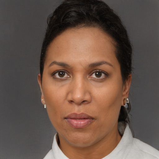 Neutral black adult female with short  brown hair and brown eyes