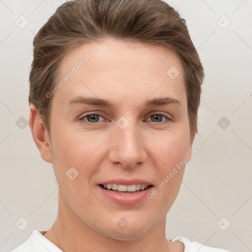 Joyful white young-adult female with short  brown hair and grey eyes