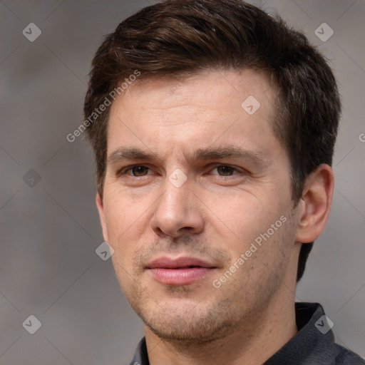 Joyful white adult male with short  brown hair and brown eyes