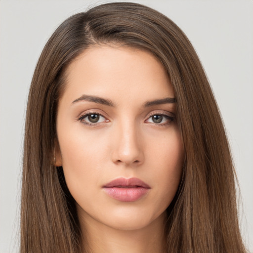 Neutral white young-adult female with long  brown hair and brown eyes