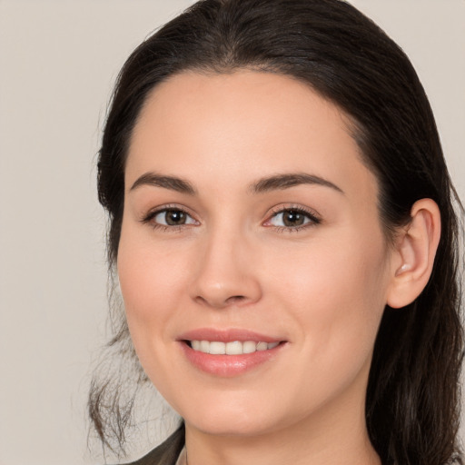 Joyful white young-adult female with medium  brown hair and brown eyes