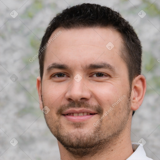 Joyful white young-adult male with short  brown hair and brown eyes