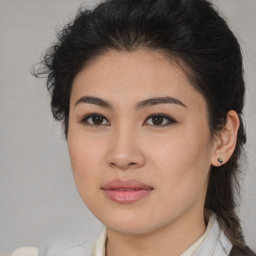 Joyful asian young-adult female with medium  brown hair and brown eyes