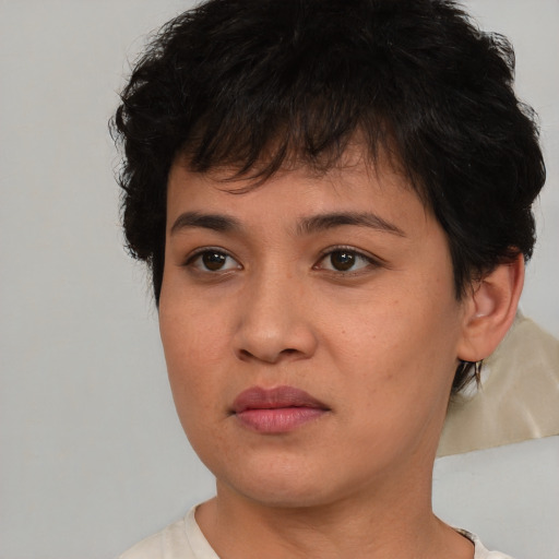 Joyful asian young-adult female with short  brown hair and brown eyes