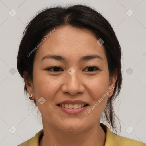 Joyful asian young-adult female with medium  brown hair and brown eyes