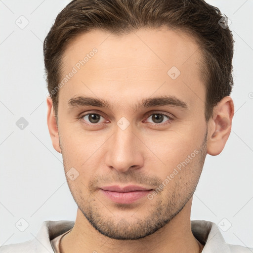 Joyful white young-adult male with short  brown hair and brown eyes