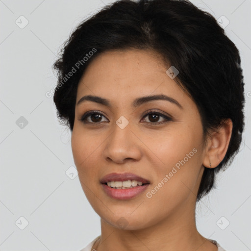 Joyful latino young-adult female with medium  brown hair and brown eyes