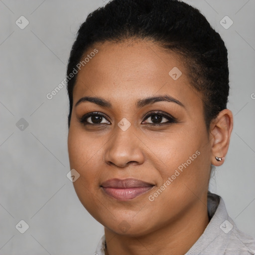 Joyful black young-adult female with short  black hair and brown eyes