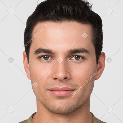 Joyful white young-adult male with short  brown hair and brown eyes