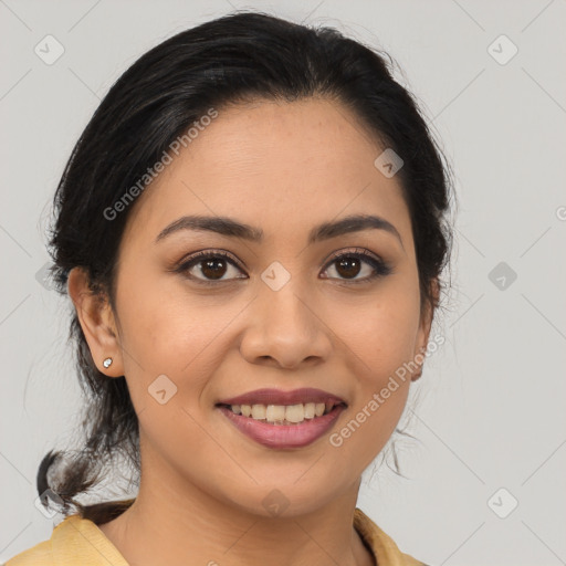 Joyful latino young-adult female with medium  brown hair and brown eyes