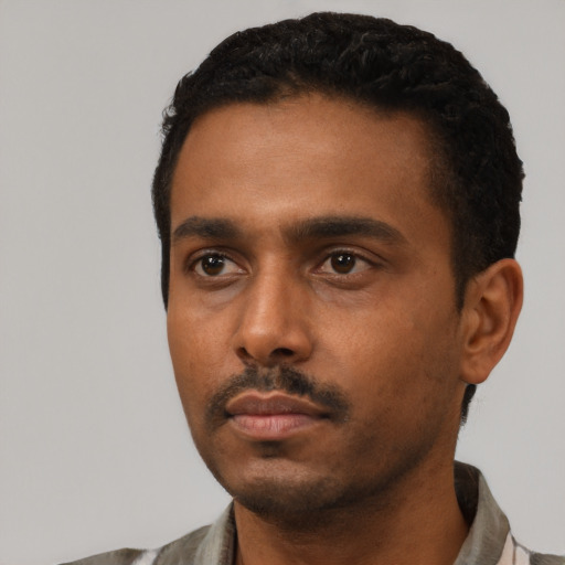 Neutral black young-adult male with short  black hair and brown eyes