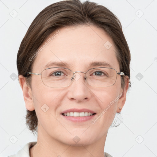 Joyful white adult female with medium  brown hair and grey eyes