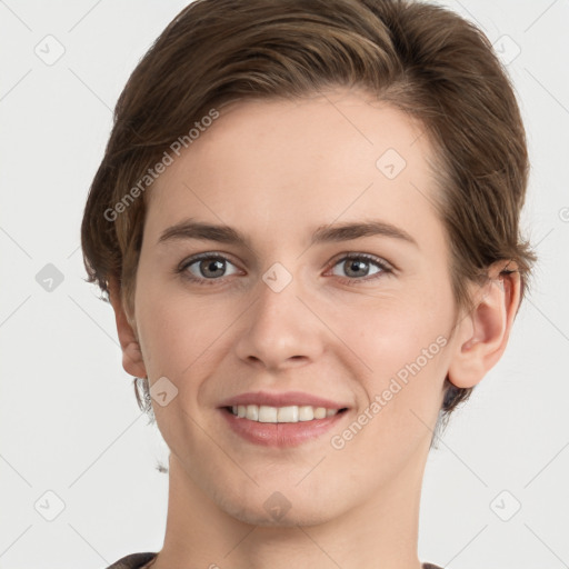 Joyful white young-adult female with short  brown hair and grey eyes