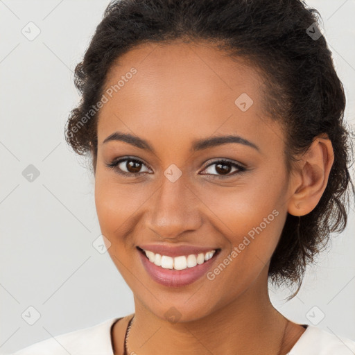 Joyful latino young-adult female with long  brown hair and brown eyes