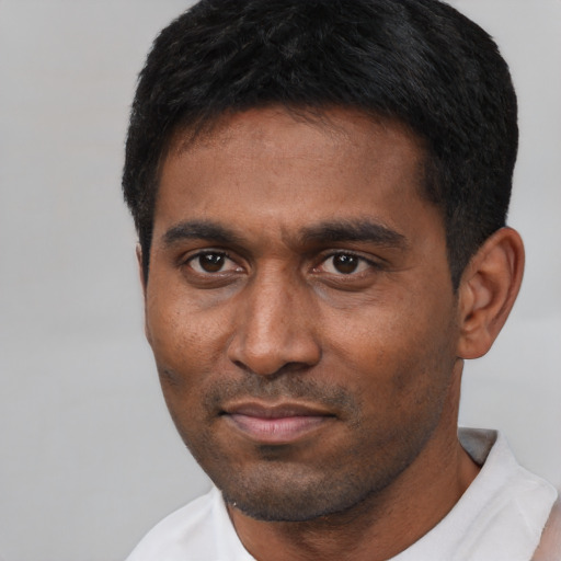 Neutral latino adult male with short  black hair and brown eyes