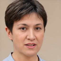 Joyful white adult female with short  brown hair and brown eyes