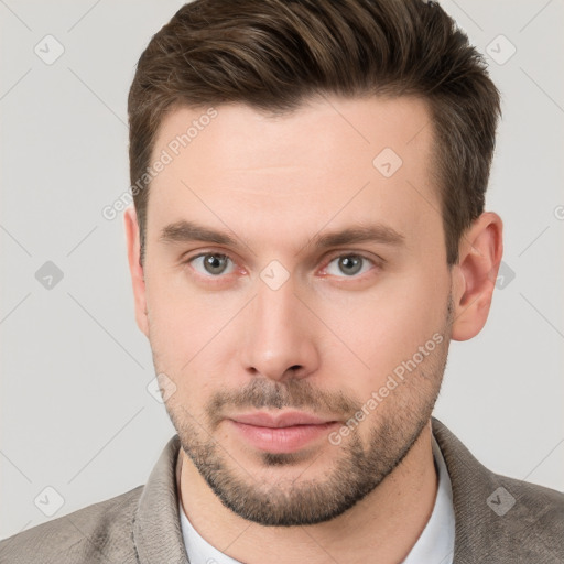 Neutral white young-adult male with short  brown hair and grey eyes