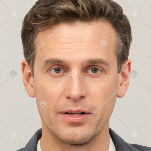 Joyful white adult male with short  brown hair and brown eyes