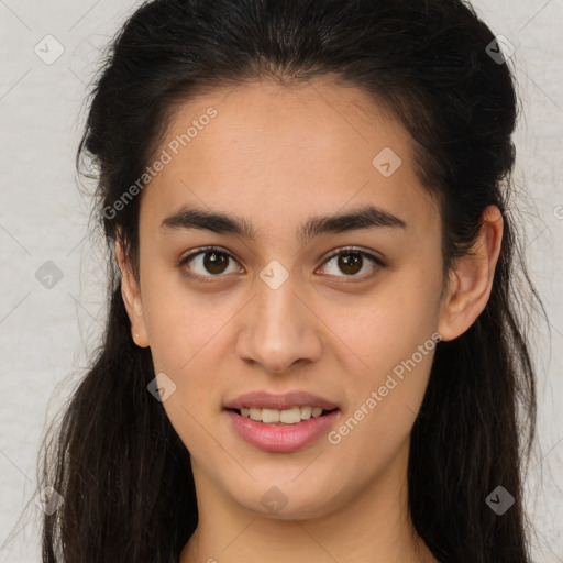 Joyful latino young-adult female with long  brown hair and brown eyes