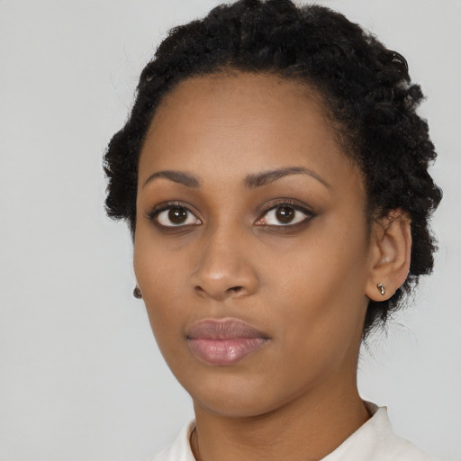 Neutral black young-adult female with short  black hair and brown eyes