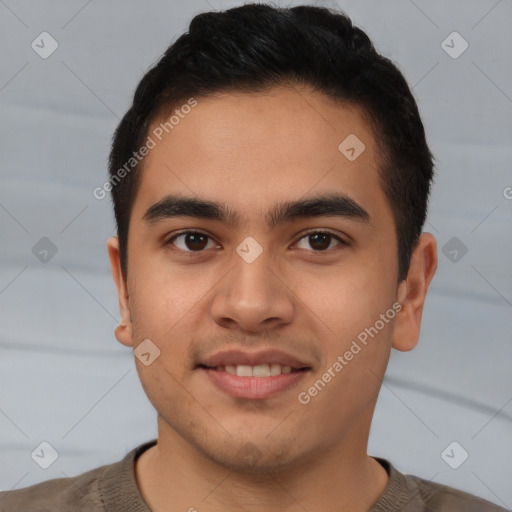 Joyful latino young-adult male with short  brown hair and brown eyes