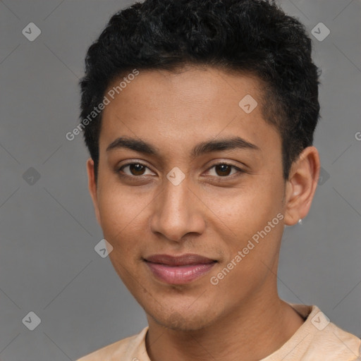 Joyful latino young-adult male with short  brown hair and brown eyes