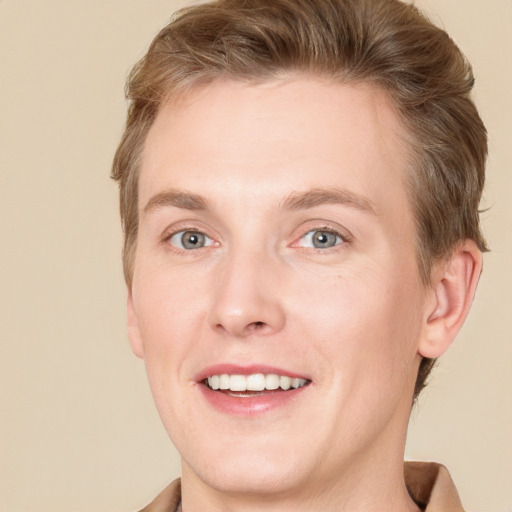 Joyful white adult male with short  brown hair and grey eyes